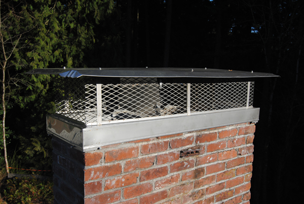 Our shiny new stainless steel chimney cap.
