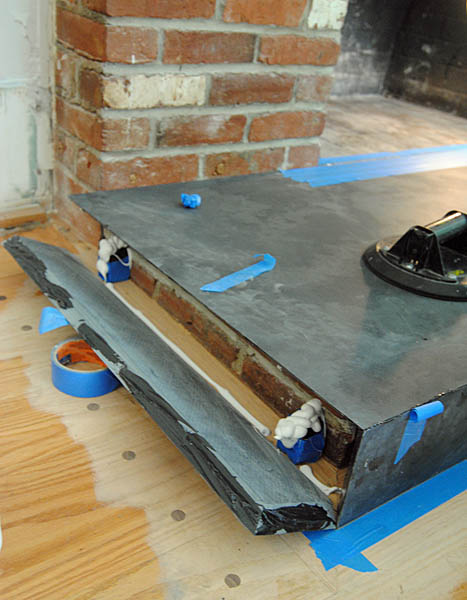 They put a lot of super smelly adhesive on the floor and miters of the slab to hold it together.